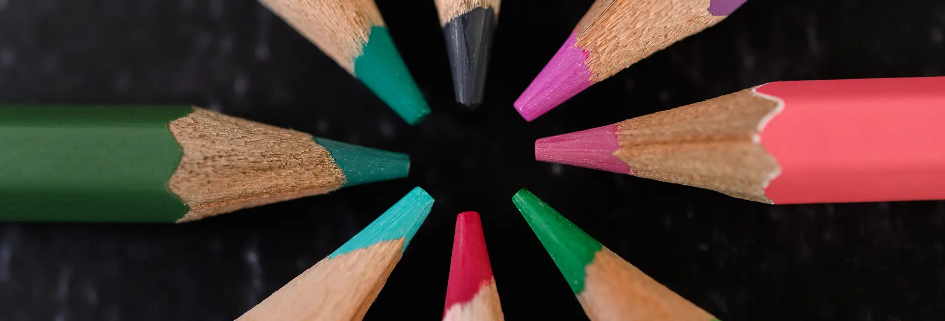 Different colored pencils in a circle.