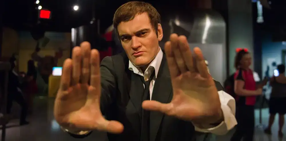 Quentin Tarantino framing the scene with his hands.