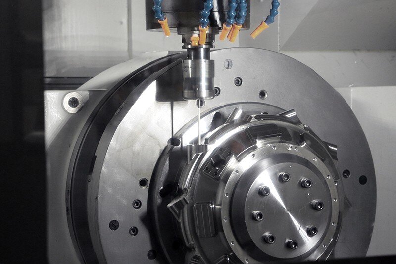 Okuma CNC machine drilling parts.