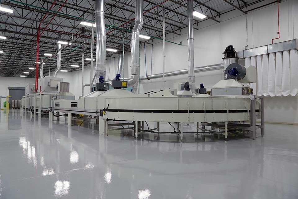 Industrial photo of cabinet finishing operation.