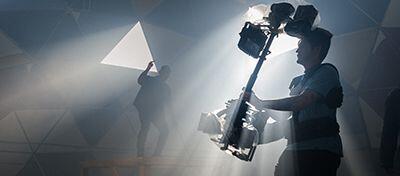 Cinematography using steadicam on set.