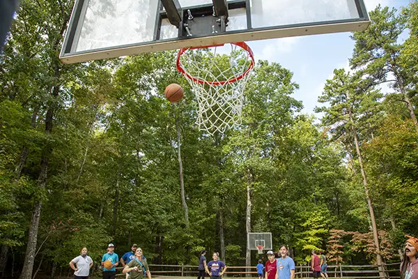 Campers playing basketball at camp.