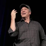 Event photo of Mike Rowe speaking at an even in California.